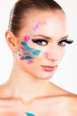 Model girl with fake long eyelashes blue eyes smokey eye shadow abstract makeup