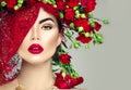 Model girl with red roses flower wreath and fashion makeup. Flowers hairstyle Royalty Free Stock Photo