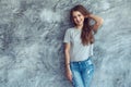 Model in gray t-shirt over street wall