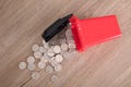 A model of hazardous trash can littered with a lot of dollar coins.The Chinese characters on the trash can mean`Harmful refuse`and