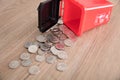 A model of hazardous trash can littered with a lot of dollar coins.The Chinese characters on the trash can mean`Harmful refuse`and