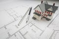 Model Home, Engineer Pencil and Ruler Resting On House Plans Royalty Free Stock Photo