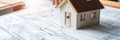 Model house on architectural blueprint Royalty Free Stock Photo