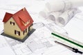 Model house on a construction plan Royalty Free Stock Photo