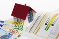 Model house with energy performance certificate and bunch of euro notes Royalty Free Stock Photo