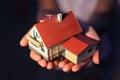 Model of house with garage on hands Royalty Free Stock Photo