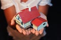 Model of house with garage on hands Royalty Free Stock Photo