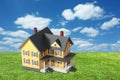 Model house on green grass with sky Royalty Free Stock Photo