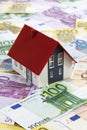 Model house on heap of euro notes Royalty Free Stock Photo