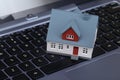 Model house on laptop computer keyboard Royalty Free Stock Photo