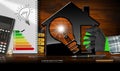 Model House and Light Bulb - Energy Efficiency Royalty Free Stock Photo