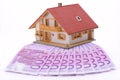 Model house on many Euro banknotes Royalty Free Stock Photo