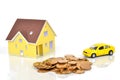 Model house and toy car with coins Royalty Free Stock Photo