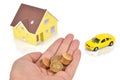 Model house and toy car with coins Royalty Free Stock Photo