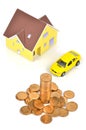 Model house and toy car with coins Royalty Free Stock Photo