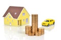 Model house and toy car with coins Royalty Free Stock Photo