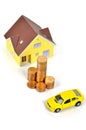 Model house and toy car with coins Royalty Free Stock Photo