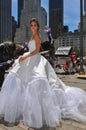 Model Kalyn Hemphill poses in front of horse carriage