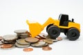 Model loader, coins stack on white background for money saving concept