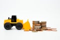 Model loader, coins stack on white background for money saving concept