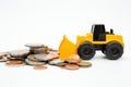 Model loader, coins stack on white background for money saving concept