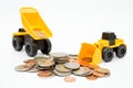 Model loader, Dump truck, coins stack on white background for money saving concept