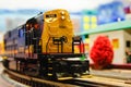 Model Locomotive at the depot with model train on the track Royalty Free Stock Photo