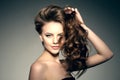 Model with long hair. Waves Curls Hairstyle. Hair Salon. Updo. F