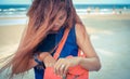 Model looking for something in hand bag. Royalty Free Stock Photo