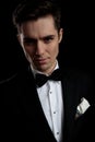 Model man in black tuxedo arousing with his look