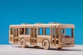 Toy, wooden bus on blue. Royalty Free Stock Photo