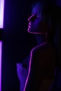 Model in neon studio, phosphorescent paint