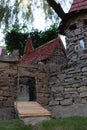 Model of old castle with bridge over ditch, stone walls and watch tower Royalty Free Stock Photo