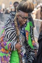 Model with an original hairstyle wearing a zebra jacket