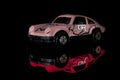 The Model Of  Pink Car With Refllection, Or Red Car  Toy Royalty Free Stock Photo