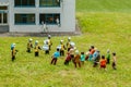 Model police station and rioters at a model village in England