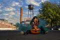 Model Poses With A Jack O Lantern For The Halloween holiday in the United States