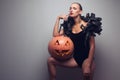 Model posing with halloween pumpkin