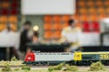 Model railroad. Locomotives with people on the background.