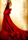 Model Red Dress, Fashion Blonde Woman in long Evening Gown Back Side View. Yellow Lighting Background Royalty Free Stock Photo