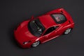 Model of a red sports car on a dark background Royalty Free Stock Photo