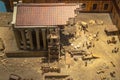 Model of the Roman temple of Diana with Corinthian style marble columns and cornice and the palace of the Count of Corbos with