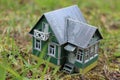 A model of a Russian country house with a barn and a well. Royalty Free Stock Photo