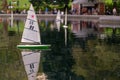 Model sailboat in park pond Royalty Free Stock Photo