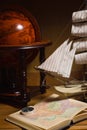 Model sailing ship, globe and compass Royalty Free Stock Photo