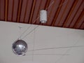 Model of the satellite Sputnik hangs Royalty Free Stock Photo
