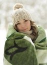 Attractive, cute, beautiful girl wrapped up warm plaid, blanket winter