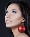 Model with sparkling christmas ornament earrings Royalty Free Stock Photo