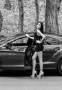 Model that stands out. Fashion model pose at automobile. Sensual woman and new car model. Model agency. Car modeling