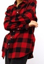 Model in studio. Trendy fall winter casual outfit with red checkered shirt. Fashion lookbook concept